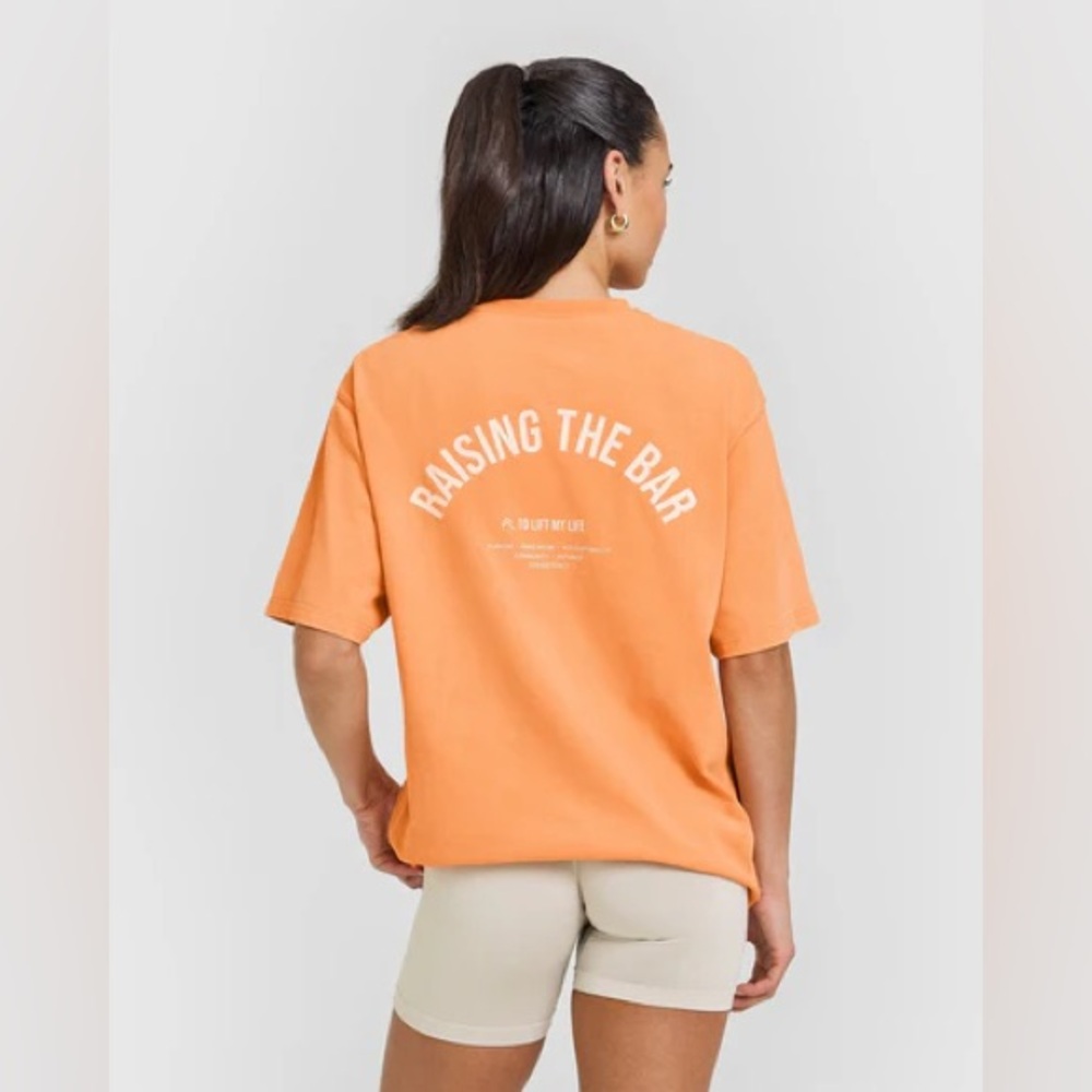 Oner active Graphic Tshirt Apricot orange. Size LARGE